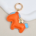 Orange leather horse keychain with blue accents and a golden lucky money bag charm - Large / Orange