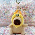 Plush Capybara keychain in yellow chick hood with golden ring for bags and keys - Dragon Horn Hat Light Brown + Gold Clip