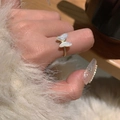 Elegant gold bow ring with white shell luster butterfly on model finger - White Butterfly Style (J3271)