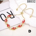 Adjustable golden Hamsa Hand bracelet with red enamel eyes and white zircon stones - Red