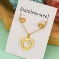 Close-up of golden double heart stainless steel necklace and earrings jewelry set - Hollow Heart Set