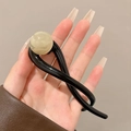Barrette à cheveux noire vintage avec une grande perle crème élégante pour femme - Pince à Cheveux Torsadée / Noir Brillant avec Perle Champagne