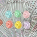 Colorful mini round resin charms in 6 vibrant colors on a holographic shell plate - Letter O