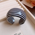 Close-up of wide C-shaped resin bracelet with black and white horizontal stripes - 43# Bangle-Black-White-Horizontal Stripe