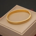 Close-up of golden stainless steel bracelet with vintage braided texture and side clasp - Woven Fishbone Texture Style (7#)