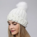 White winter knit beanie featuring faux fur pom-pom and elegant pearl embellishments - One Size / White