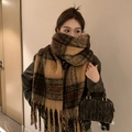 Brown checkered mohair scarf with thick fringes shown on a model in a minimalist setting - Light Maillard Plaid