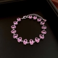 Macro detail of pink zircon gradient bracelet with silver finish on black leather texture - 67# Silver Pink Oval Style