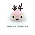 Detail view of 6cm plush reindeer cartoon pin with embroidered face and size markings - Pink Reindeer Patch