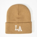 Detailed close-up of camel knit beanie featuring a white 3D embroidered LA logo - Camel