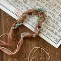 Detail of bohemian braided waist chain with turquoise beads on vintage wood surface - Brown Ribbon Wood Metal Chain Style