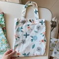 Detailed view of the copper button closure and floral patterns on cotton handbag - White Base Blue Leaf Blue Pink Flower(T-21)