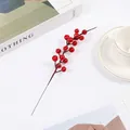 Macro detail of glossy red artificial winterberry branches for festive home decoration - Red 17 Berries