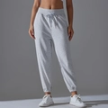 Primer plano de la cintura alta con cordón y textura de punto suave de los joggers grises - S / Gris Jaspeado