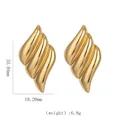 Detailed view of gold stainless steel wavy earrings with size labels 35mm by 19mm - Stacked 3D Wave Earrings