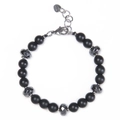 Macro shot of matte black beaded bracelet with faceted hematite and stainless steel clasp - Matte Stone Bracelet