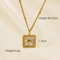 Detail view of a gold square pendant necklace with star motif and size specifications - White Shell Square