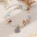 Dettaglio del bracciale stile oceano con perle blu e ciondoli a forma di conchiglia - Stile Oceano Blu Lago Argento Antico (09 Argento Antico Blu Lago 3283)
