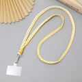 Detail van geel-wit gevlochten telefoonkoord met metalen clip en transparante patch - 12mm Breedte / Wit Geel Groen
