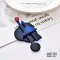 Abstract geometric acrylic brooch featuring dark blue and red circular resin elements - Deep Blue Series 11