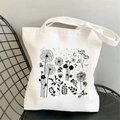 White canvas tote bag featuring black floral and dandelion illustration print - STD704-E Black Floral
