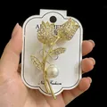 Golden tulip brooch with sparkling rhinestones and a large elegant white pearl - Tulip Flower Pearl