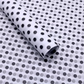 Detail view of semi-transparent black and white polka dot silk tissue paper texture - White with Black Dots