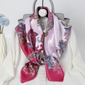 Elegant 90cm paisley print satin scarf in pink and gold on a white shirt and handbag - Rose Red