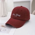 Classic burgundy cotton baseball cap with New York white embroidery in a minimalist setting - Dark Red