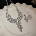 Vintage style floral jewelry set with silver rhinestones and leaf-shaped earrings - Diamond-encrusted Flower And Leaf Stud Earrings And Necklace (two-piece Set)
