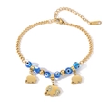 Détails du bracelet en acier doré avec perles œil de démon bleues et breloques éléphant - 31404-Style Pendentif Éléphant