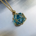 Blue D20 dice pendant necklace with gold wire cage and delicate matching chain - Gold Cage with Sky Blue Dice