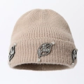 Macro detail of beige knitted beanie featuring sparkling leaf rhinestone decorations - One Size / Camel