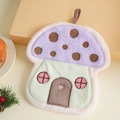 Detail of mushroom-shaped coral fleece hand towel with hanging loop and thick absorbent texture - Purple