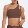 Detail view of dark brown one-shoulder sports bra featuring cutout strap and elastic fabric - S / Chestnut Brown