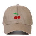 Close-up of the detailed red cherry embroidery on the khaki cotton twill baseball cap - Adjustable / Khaki
