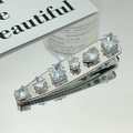 Silver metal hair clip featuring five sparkling clear zircon crystals in diverse shapes - 3170 White Zircon-Five Multi-faceted Clear Zirconia