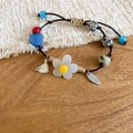 Detail of handmade beaded bracelet with resin flowers, stone beads and adjustable cord - Blue Heart Flower Beaded Style