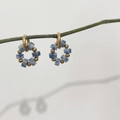 18K gold plated stainless steel hoop earrings with blue natural stone beads on a green branch - Blue Spot Stone