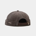 Detail of docker hat with leather strap, metal buckle, and small metallic logo plate - Adjustable / Gray