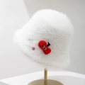 Detailed texture of white plush bucket hat with cute cherry embroidery and button accents - White