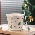 Detail of Christmas ceramic mug with green handle and festive tree-topped steel spoon - Christmas Tree (With Spoon)