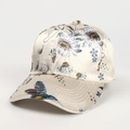 Detailed close-up of a satin baseball cap with floral prints and a colorful bird pattern - Adjustable / Beige (Flower & Bird Print)