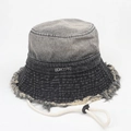 Detail of washed denim bucket hat with frayed edges and adjustable windproof cord - Black