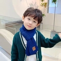Navy blue knitted kids scarf featuring a soft texture and brown EST LOVE leather patch - Kids / Navy Blue