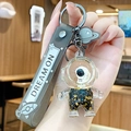 Portachiavi astronauta sabbie mobili con paillettes oro nero e cinturino in silicone - Astronauta Oro Nero - Viso Nero in Piedi