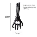 Matte black skeleton hand bottle opener with metal insert and 18cm height measurement - Black Skeleton Hand Opener