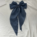 Elegant navy blue oversized satin bow hair clip with long flowing ribbon streamers - Navy Blue