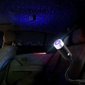 Black USB car atmosphere lamp projecting a dense blue starry sky effect inside the vehicle - [Purple-Black Shell] Auto-Rotating