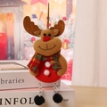 Close-up of a Christmas reindeer plush pendant with red plaid scarf and silver bead legs - F2-3 Hanging Black Leg Reindeer